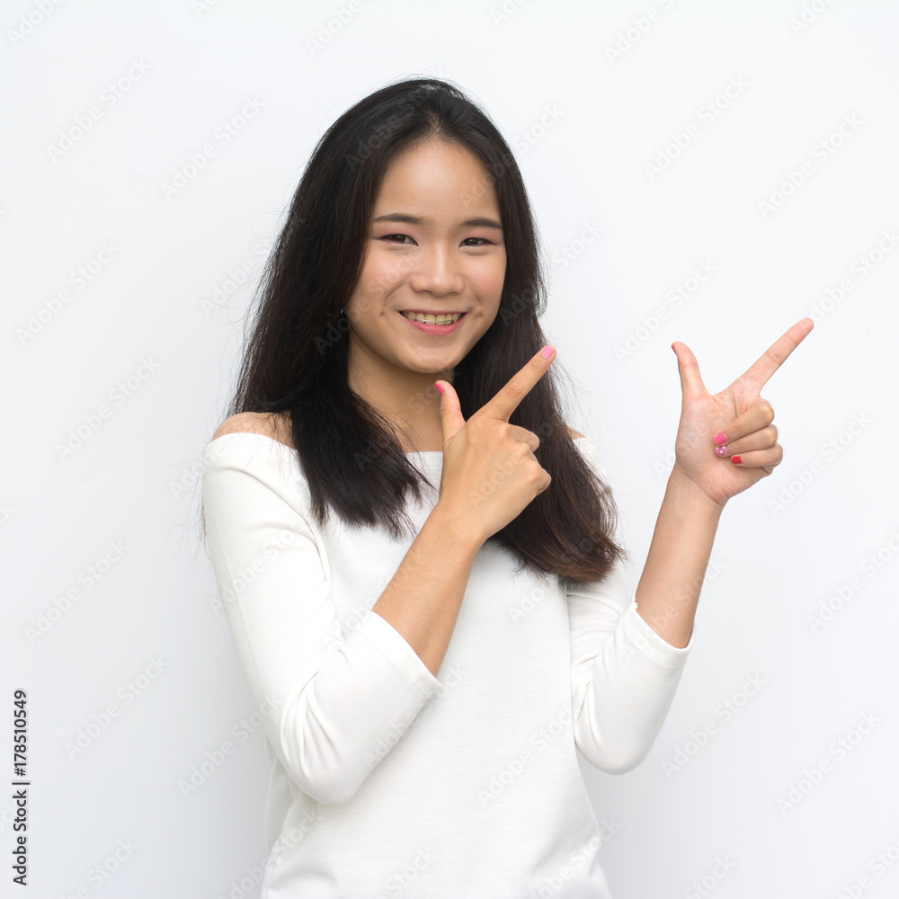 Beauty young girl with charming smile to you and points to the fact that fun smile with isolated on white background Beauty young girl with charming smile to you and points to the fact that fun smile with isolated on white background