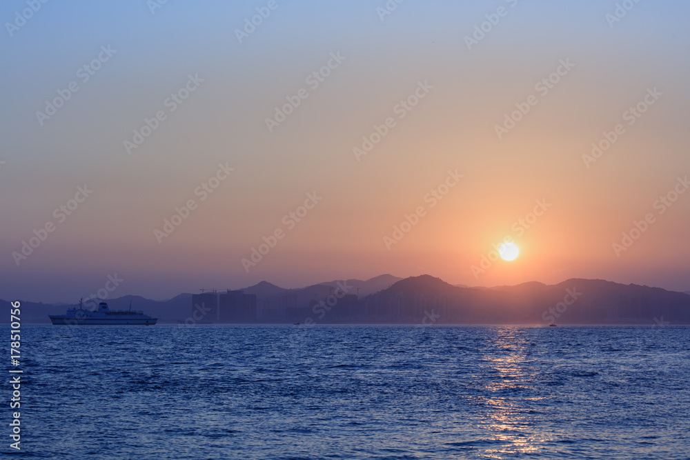 Sunset with sea and mountains