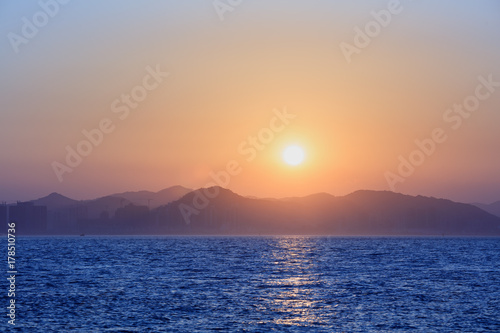 Sunset with sea and mountains
