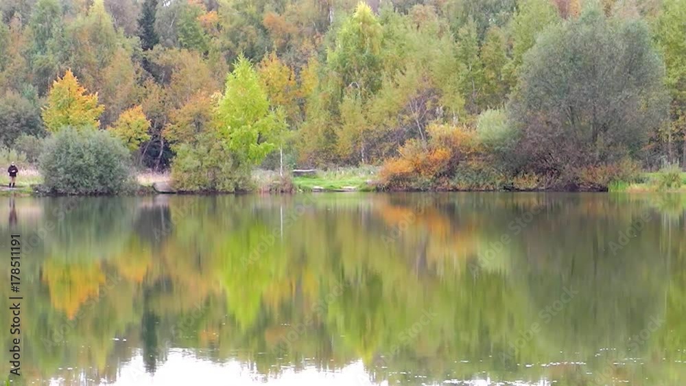 Golden Autumn in Russia. Trees are reflected in the lake. Golden Autumn in Russia. Trees are reflected in the lake.