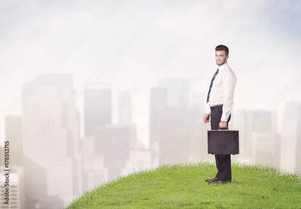 man standing in front of city landscape man standing in front of city landscape