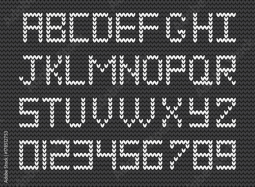 Knit alphabet and numerals on grey knitted background. Vector illustration of  Fabric script.