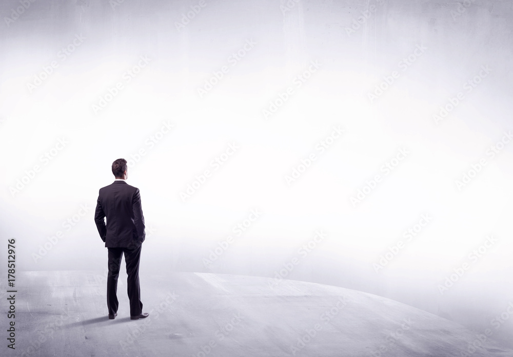 Business person standing from rear view Business person standing from rear view