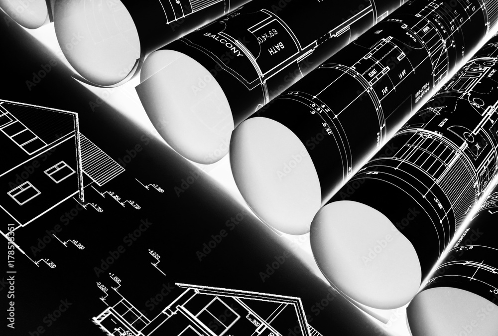 Architectural blueprints and blueprint rolls and a drawing instruments