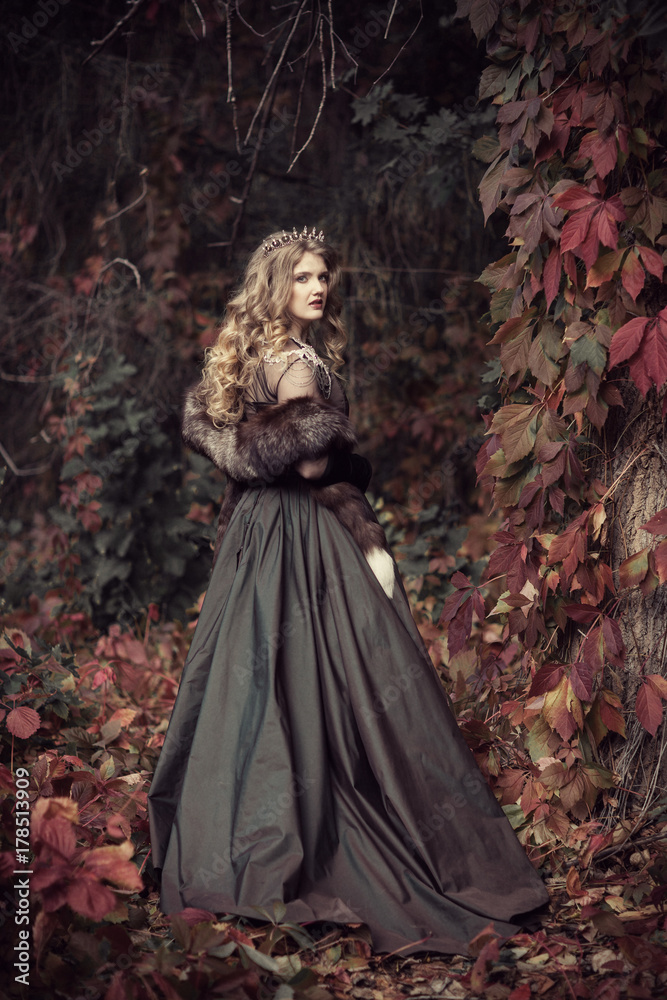 queen in furs in the autumn forest