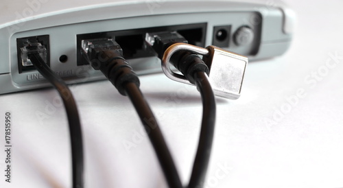 isolated router with plug in to the Internet cables and close padlock