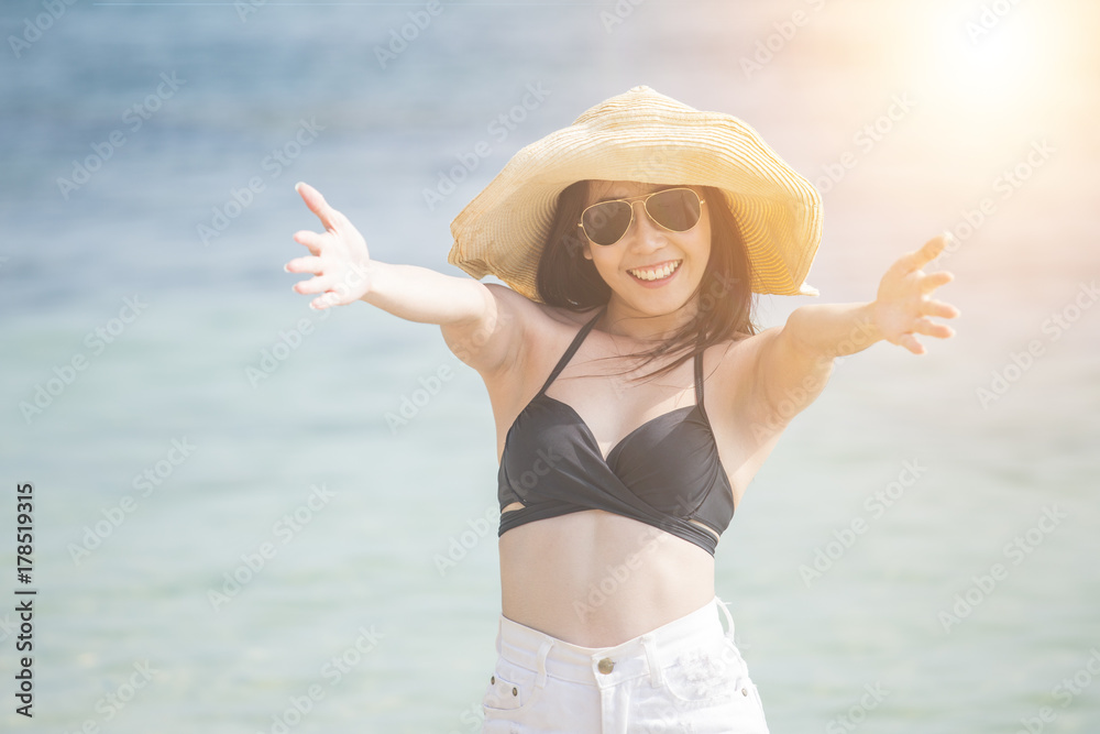 Portrait of Beautiful Woman posing at the Beach with Attractive Smiling, People with Summer Concept. Vintage Tone.