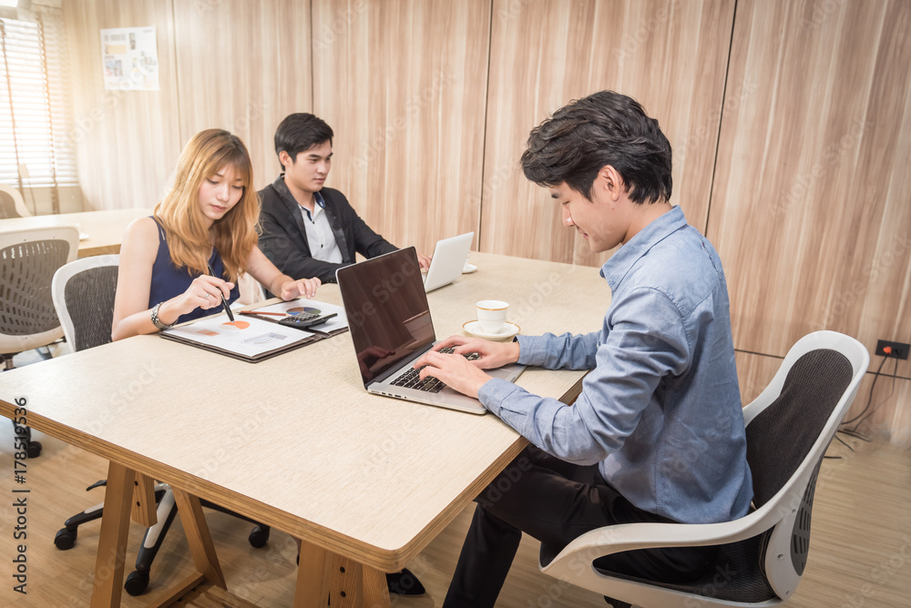 Group of Business People Working in the Office with labtop and graphic document Concept. Group of Business People Working in the Office with labtop and graphic document Concept.