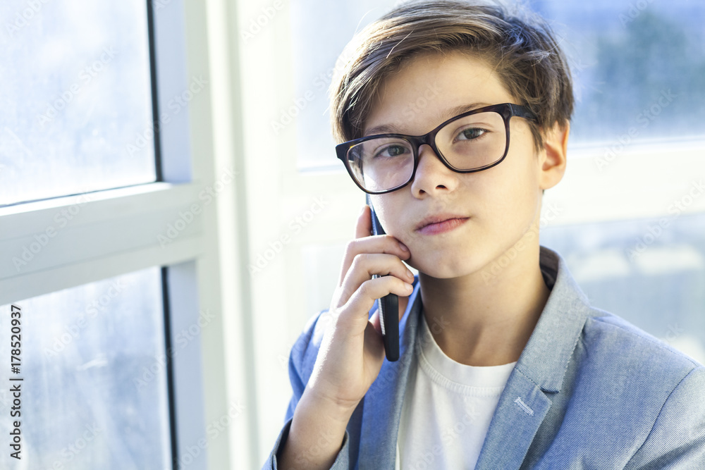 Teen boy using mobile phone Teen boy using mobile phone