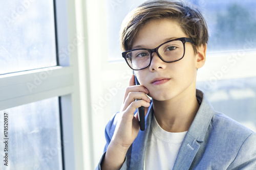 Teen boy using mobile phone