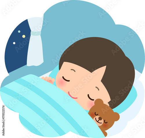 眠る幼い男の子とぬいぐるみ