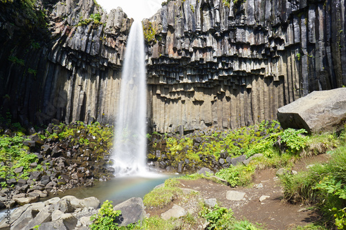 Svartifoss waterfall surrounded by dark lava columns Iceland