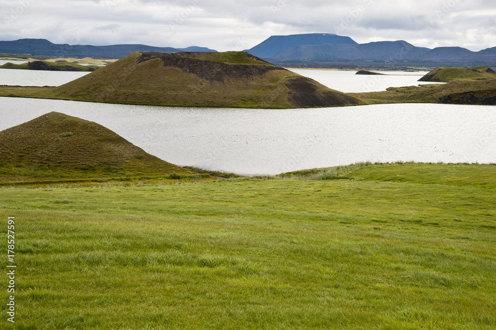 Lake Myvatn, Typical Icelandic landscape, a wild nature of rocks and shrubs, rivers and lakes.