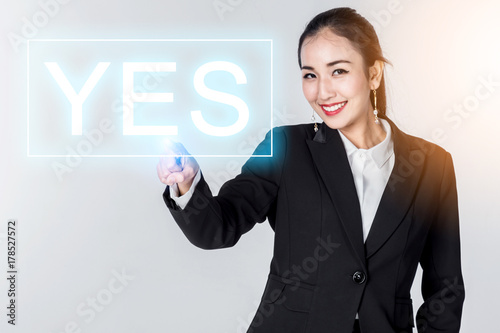 asian smart business woman push yes button with light effect business concept