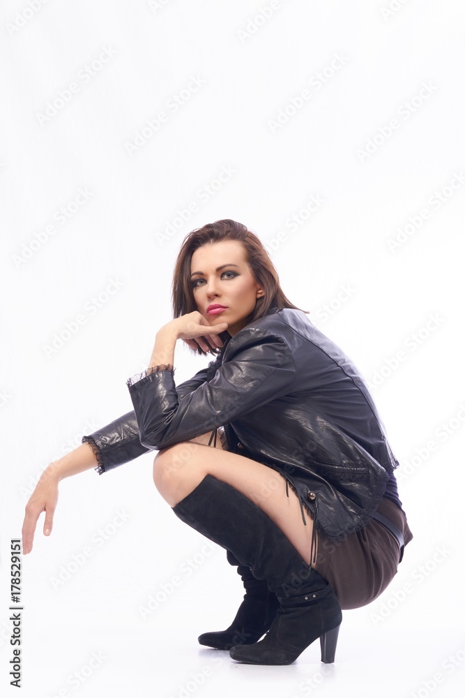 A dark-haired girl in dark clothes in front of a camera. A dark-haired girl in dark clothes in front of a camera.