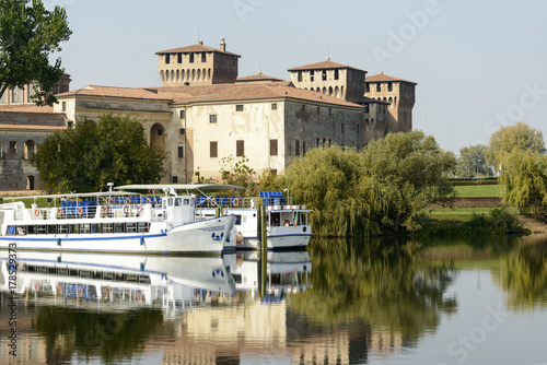 moored passenger vessels and Ducale Palace and fortress from the lake, Mantua, Italy