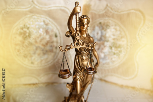 Judge, deciding on marriage divorce. Themis with wedding rings on scales. Justice concept