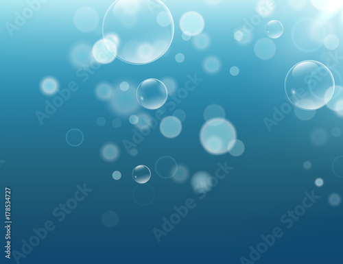 A beautiful light blue shiny background with water bubbles and bokeh. Blue water  deep sea  ocaen background template for design and print. Vector illustration  eps10