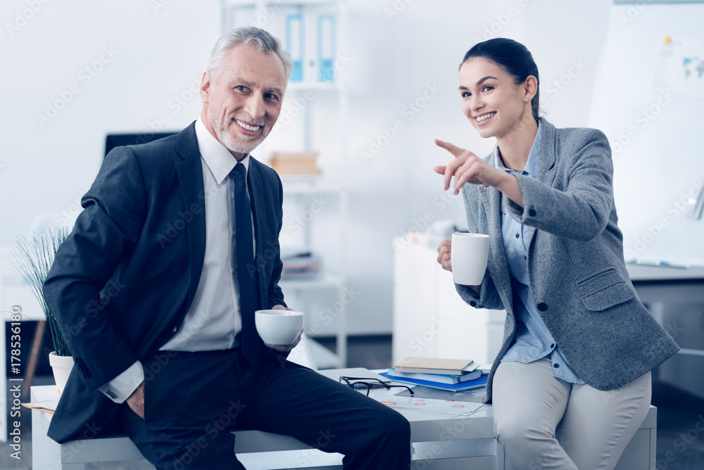 Fototapeta premium Smiling colleagues having lunch break and talking