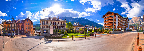 Cortina D' Ampezzo street and Alps peaks panoramic view