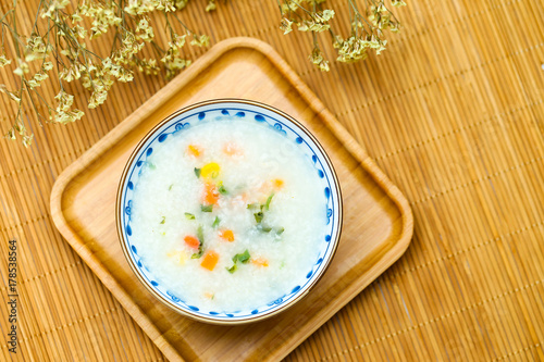 vegetable porridge in blue and white porcelain bowl