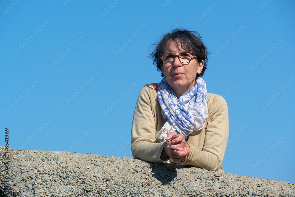 portrait of a mature woman with eyeglasses, outdoor portrait of a mature woman with eyeglasses, outdoor