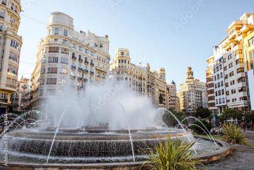 View on the Ayuntamiento square with fountain and beautiful buildings in Valencia city in Spain
