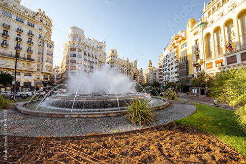 View on the Ayuntamiento square with fountain and beautiful buildings in Valencia city in Spain