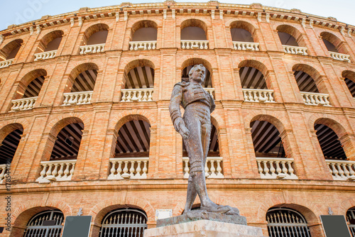 Bullring building with toreador monument in Valencia city in Spain