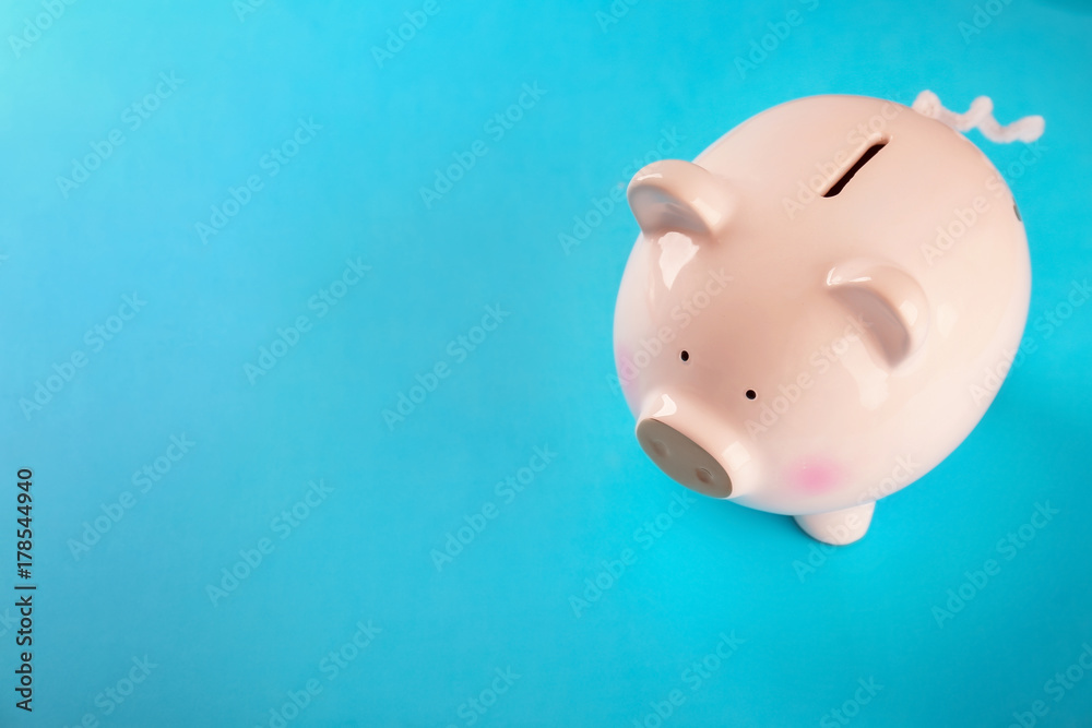 Cute piggy bank on color background Cute piggy bank on color background