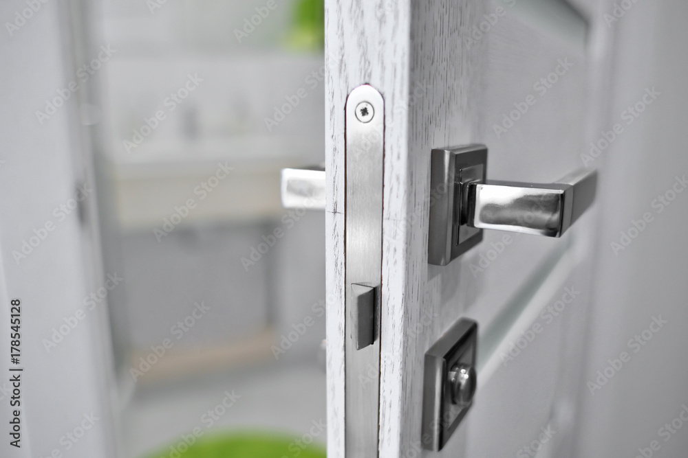 Open door in modern apartment, closeup Open door in modern apartment, closeup