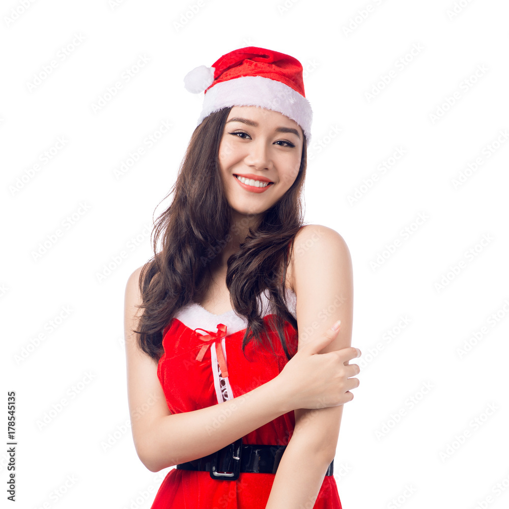 Christmas Woman. Beauty Asian Model Girl in Santa Costume isolated on White Background. Christmas Woman. Beauty Asian Model Girl in Santa Costume isolated on White Background.