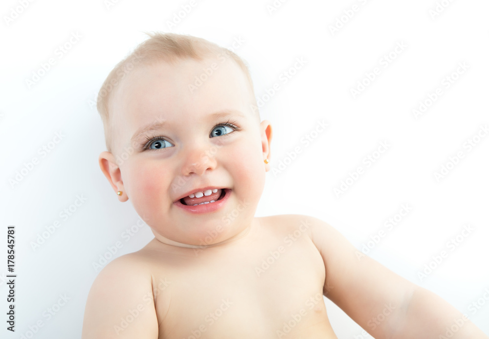Adorable smiling kid. Portrait of laughing beautiful little girl isolated on white background. Cute child's smiley face, studio shot.