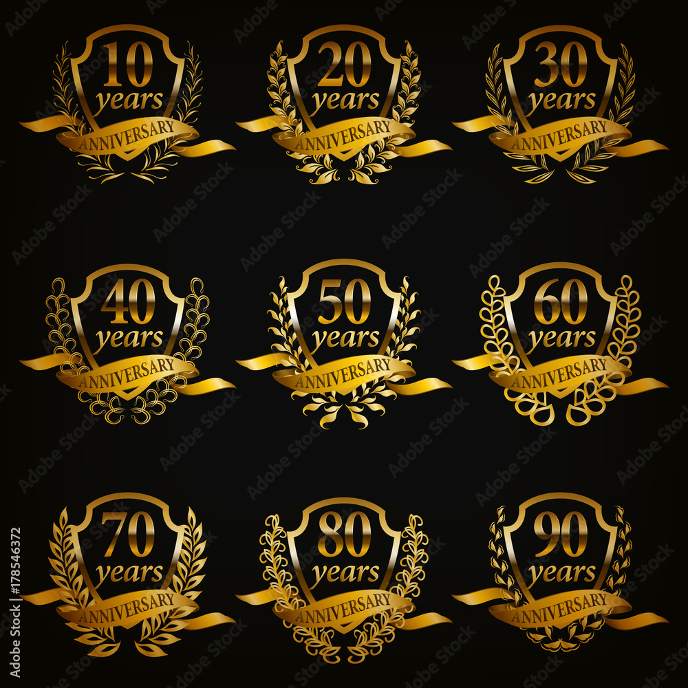 Set of gold anniversary badges with laurel wreaths, numbers. Decorative emblem of jubilee on black background. Filigree element, frame, border, icon, logo for web, page design in vintage style