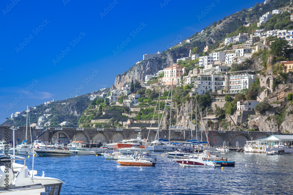 Luxury yachts harbor and villas on cliffs, mediterranean coastile, Italy