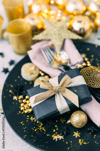 Christmas table setting in gold tones
