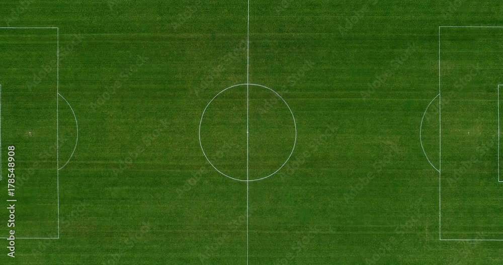 Aerial view over a green soccer field. Perfect view of a sport field (soccer/football), leisure or professionnal activity Aerial view over a green soccer field. Perfect view of a sport field (soccer/football), leisure or professionnal activity