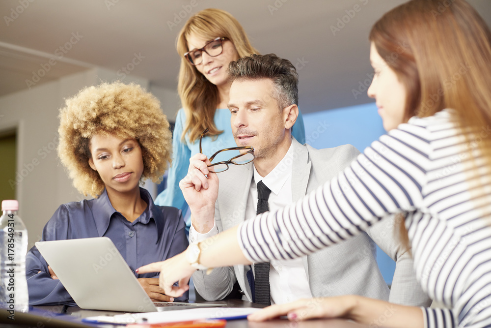 It's a great teamwork. Business team working on new project at office. It's a great teamwork. Business team working on new project at office.