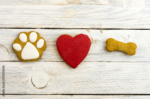 Dog's paw, red heart and bone. A dog loves bones.