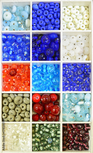 Brightly coloured Lampwork glass beads in a tray