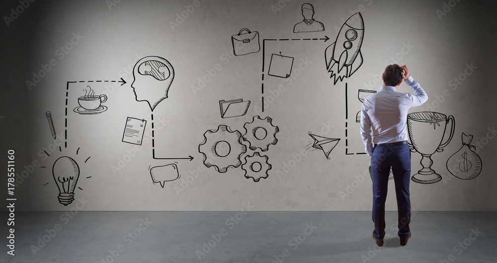Businessman watching a project sketch on a wall 3D rendering Businessman watching a project sketch on a wall 3D rendering