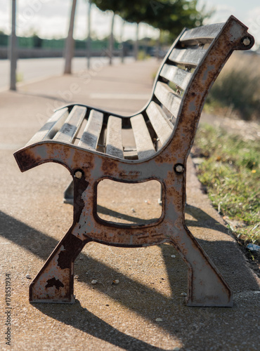 Old rusty bench on the street