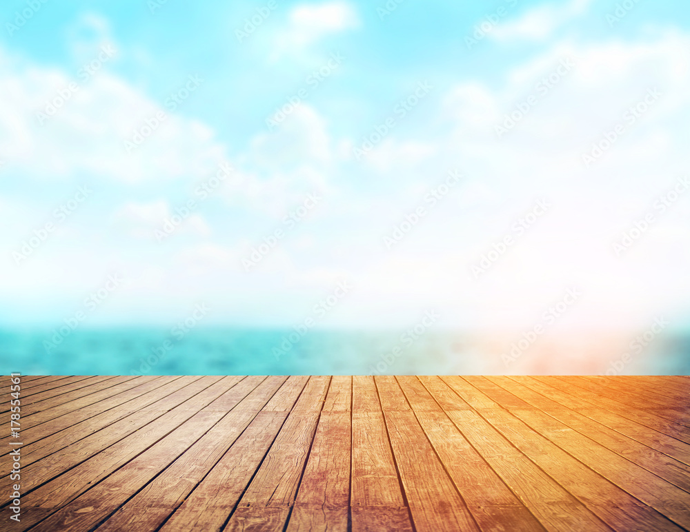 Wood table top on blur sea background. Summer, nature concepts. For montage product display or design key visual layout. Wood table top on blur sea background. Summer, nature concepts. For montage product display or design key visual layout.