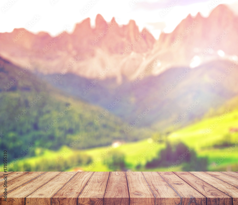 Wood table top on blur mountains background. Nature concepts. For montage product display or design key visual layout. Wood table top on blur mountains background. Nature concepts. For montage product display or design key visual layout.