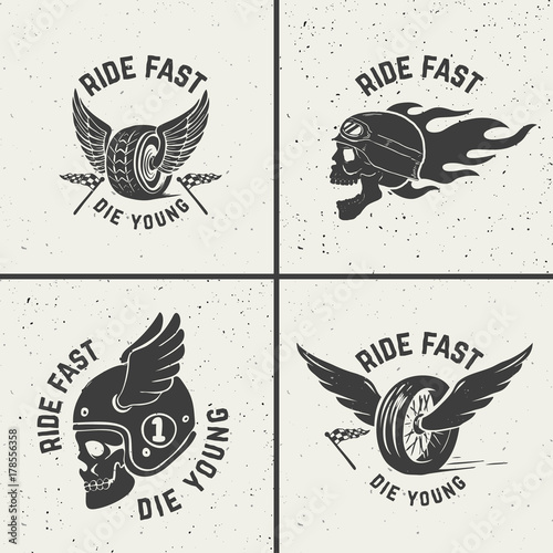 Set of hand drawn biker emblems. Skull with fire, winged wheel.