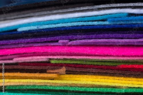 a stack of colorful acrylic felt. Multicolored macrophoto tissue