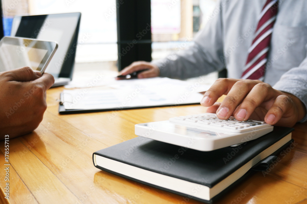 Accountant verify the business and saving money stacking gold coins with calculator. Accountancy Concept Accountant verify the business and saving money stacking gold coins with calculator. Accountancy Concept