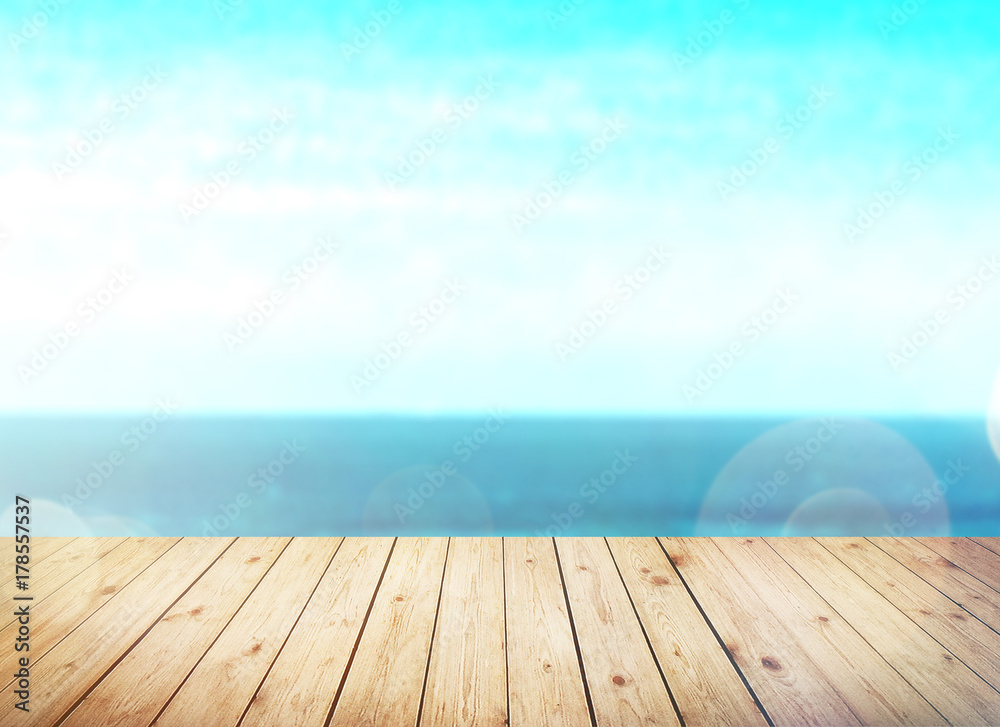 Wood table top on blur sea background. Summer, nature concepts. For montage product display or design key visual layout. Wood table top on blur sea background. Summer, nature concepts. For montage product display or design key visual layout.