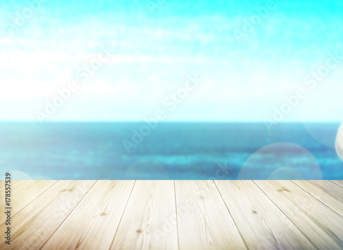 Wood table top on blur sea background. Summer, nature concepts. For montage product display or design key visual layout.