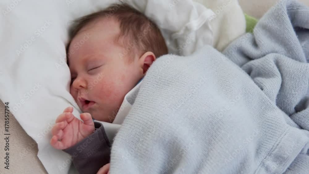 Cute newborn baby sleeping in swinging cradle Cute newborn baby sleeping in swinging cradle